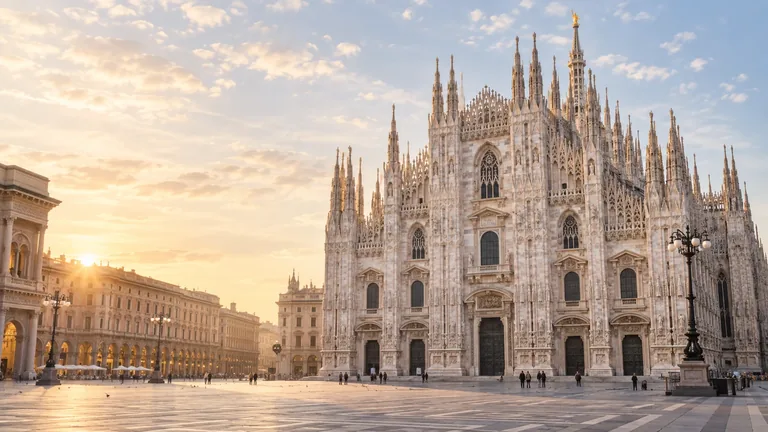Illustration of Milan's Duomo and its broad piazza in warm evening light.